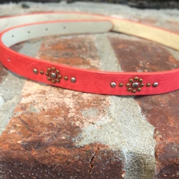 Women’s 3/4” wide coral belt with burnished gold tone and silver tone studs. 36”